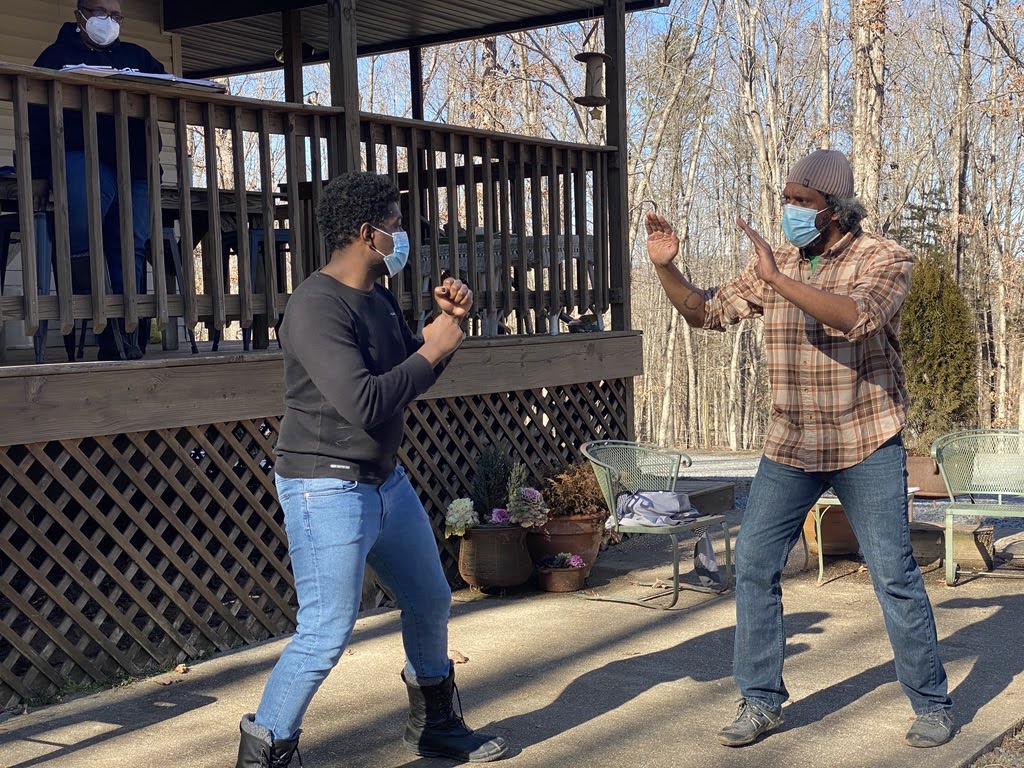 Brennen S. Malone and Lindsay Smiling rehearse fight choreography