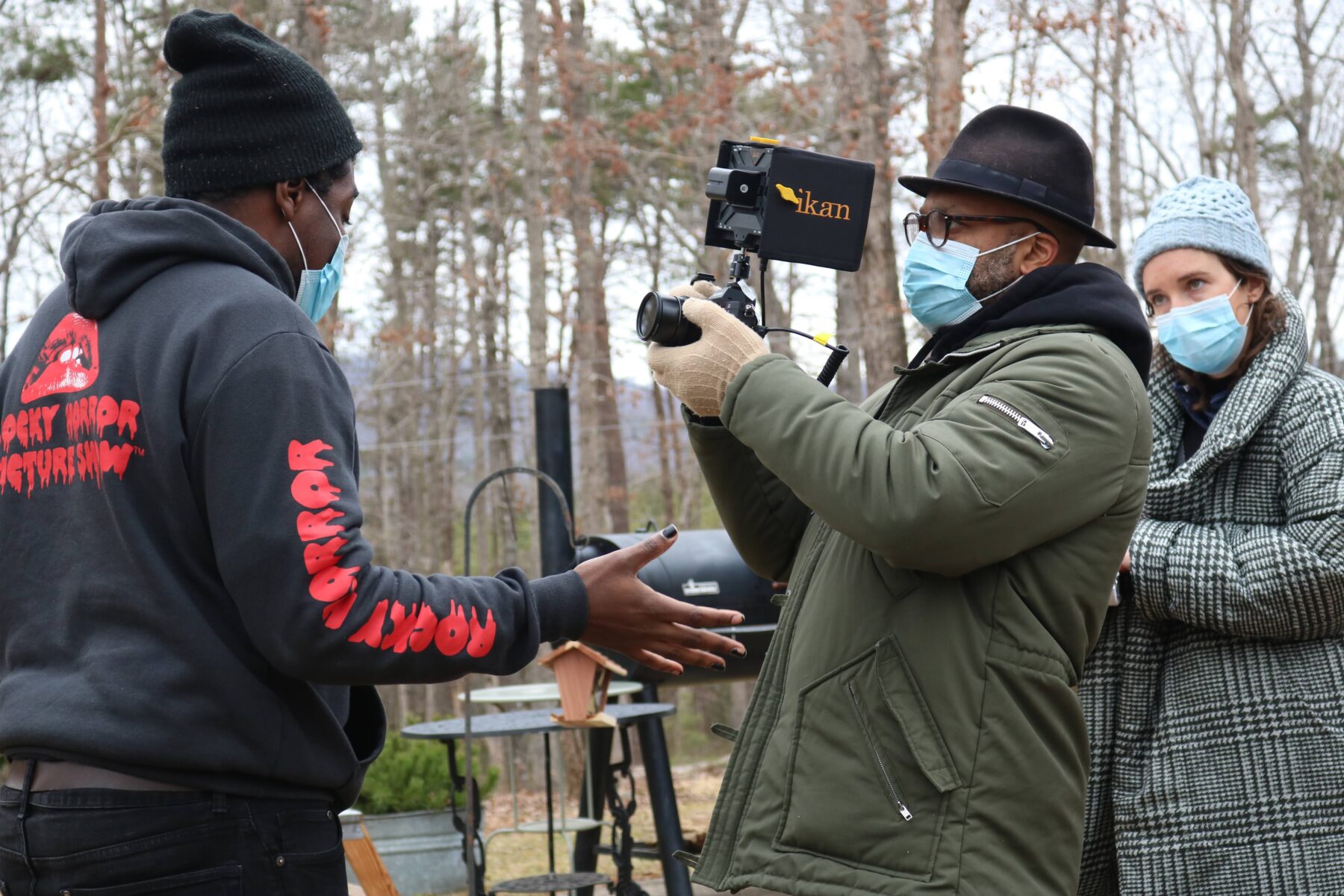 Performer Brennen S. Malone, Director of Photography Leslie Rivera, and Director Morgan Green rehearse a scene of FAT HAM.